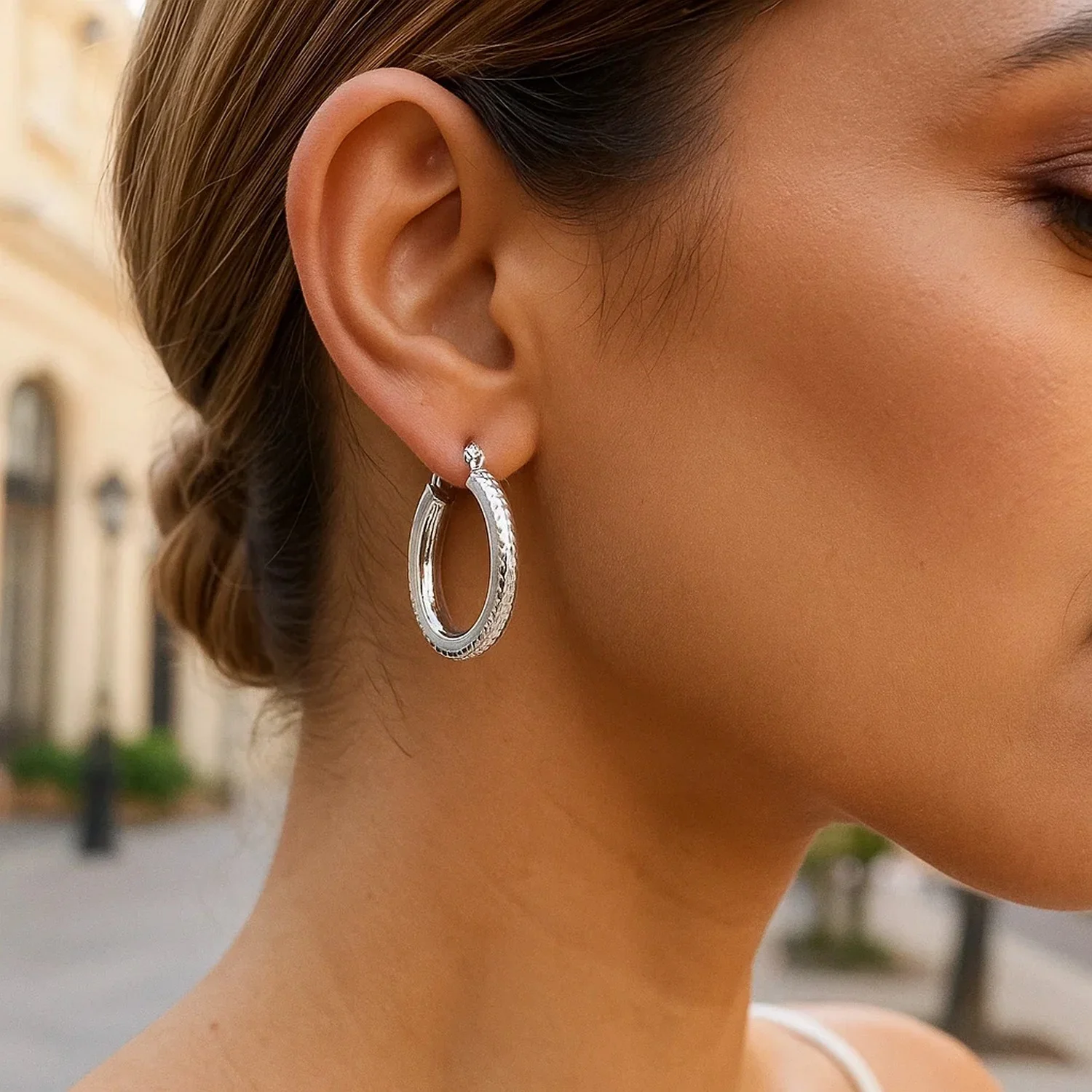 14k White Gold Diamond Cut Textured Oval Hoop Earrings. - Image 2