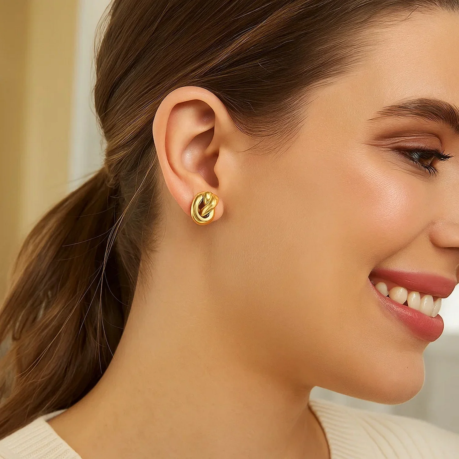 14k Yellow Gold Polished Knot Earrings - Image 2
